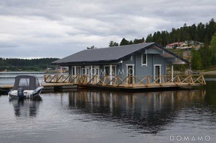 Проект деревянного дома из клееного бруса с крытой террасой расположенной по всему периметру дома