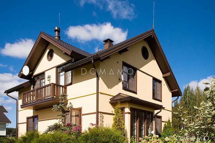 Проект дома из газобетона с эркером и спальней на первом этаже