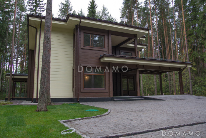 Проект двухэтажного дома из клееного бруса с парной и навесом для авто