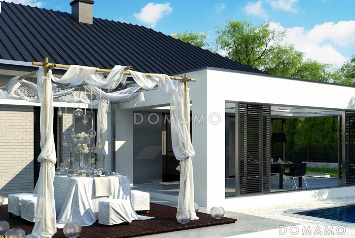 Проект комфортного одноэтажного дома из газобетона с панорамным остеклением обеденной зоны и гаражом