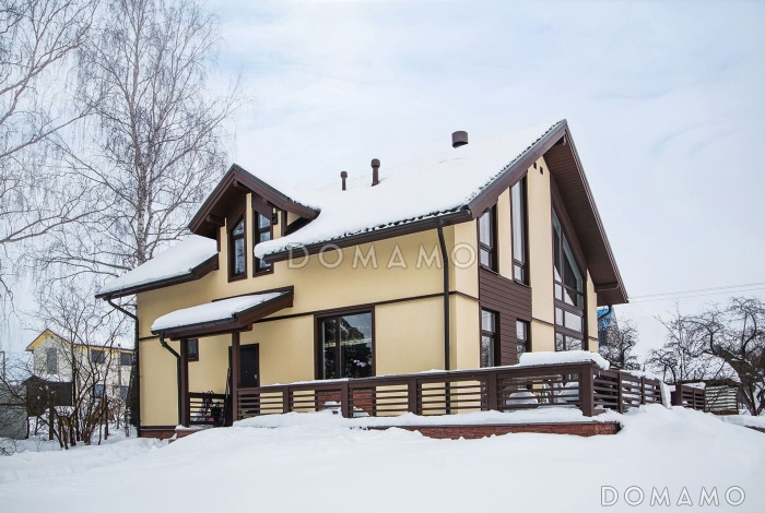 Проект каркасного дома с террасой, мансардой и вторым светом