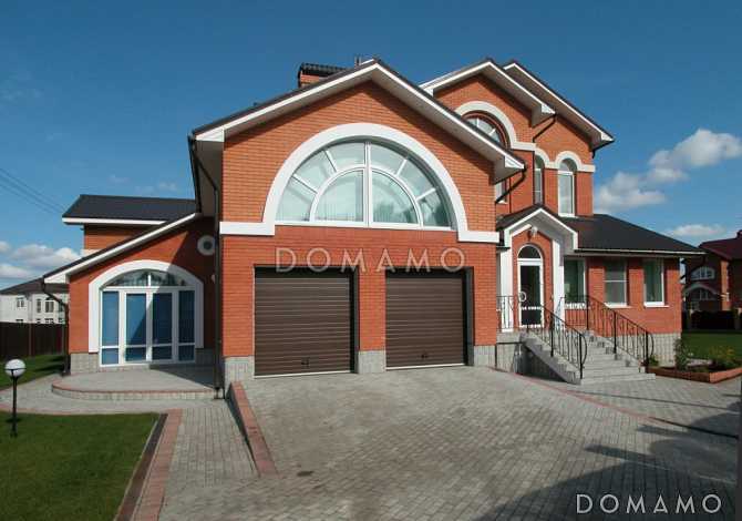 Проект загородного дома с бассейном и гаражом на 2 машины 