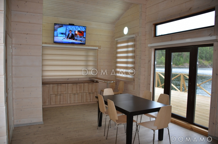 Проект деревянного дома из клееного бруса с крытой террасой расположенной по всему периметру дома